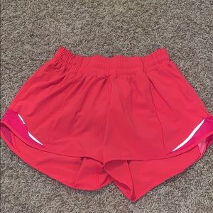 Neon pink lululemon tall hotty hot shorts 4”